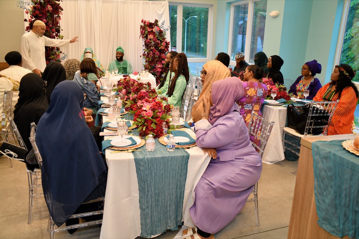 The Imam offering a blessing to the couple